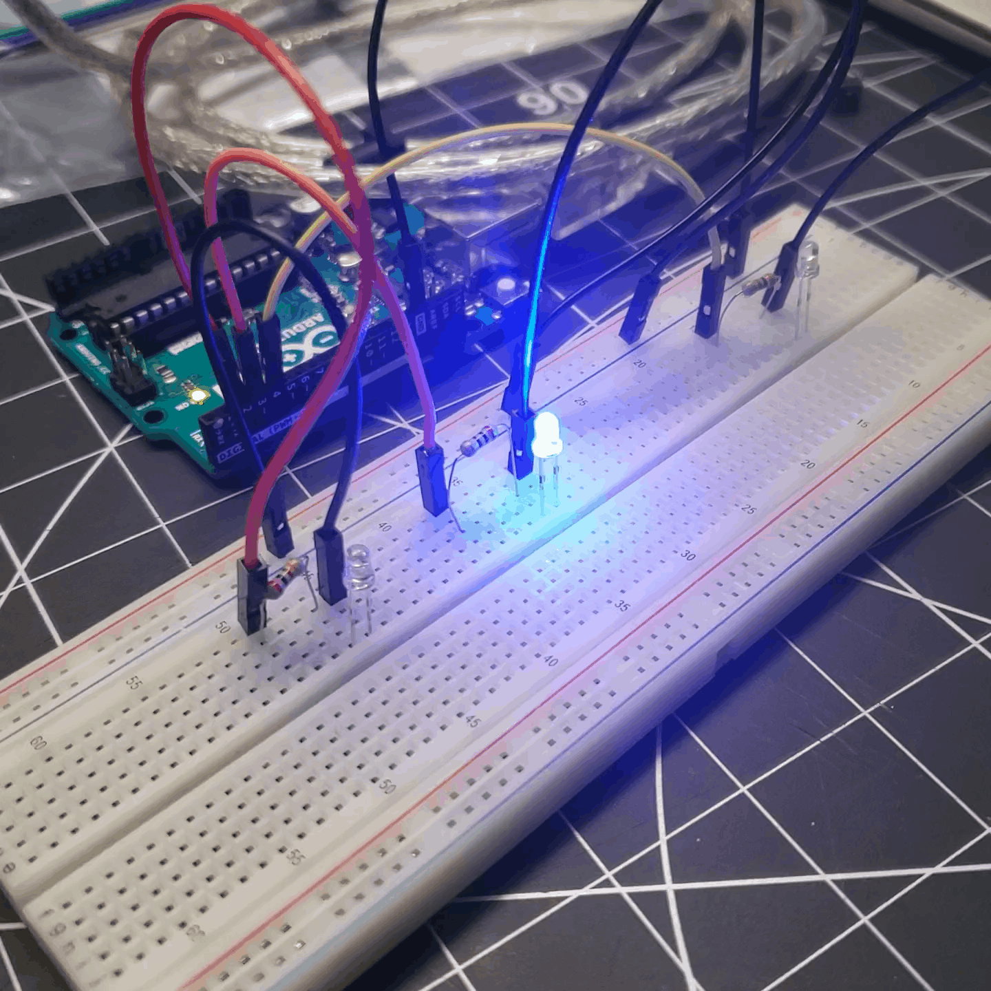 Made one blue light and two green lights turn on and off alternately.